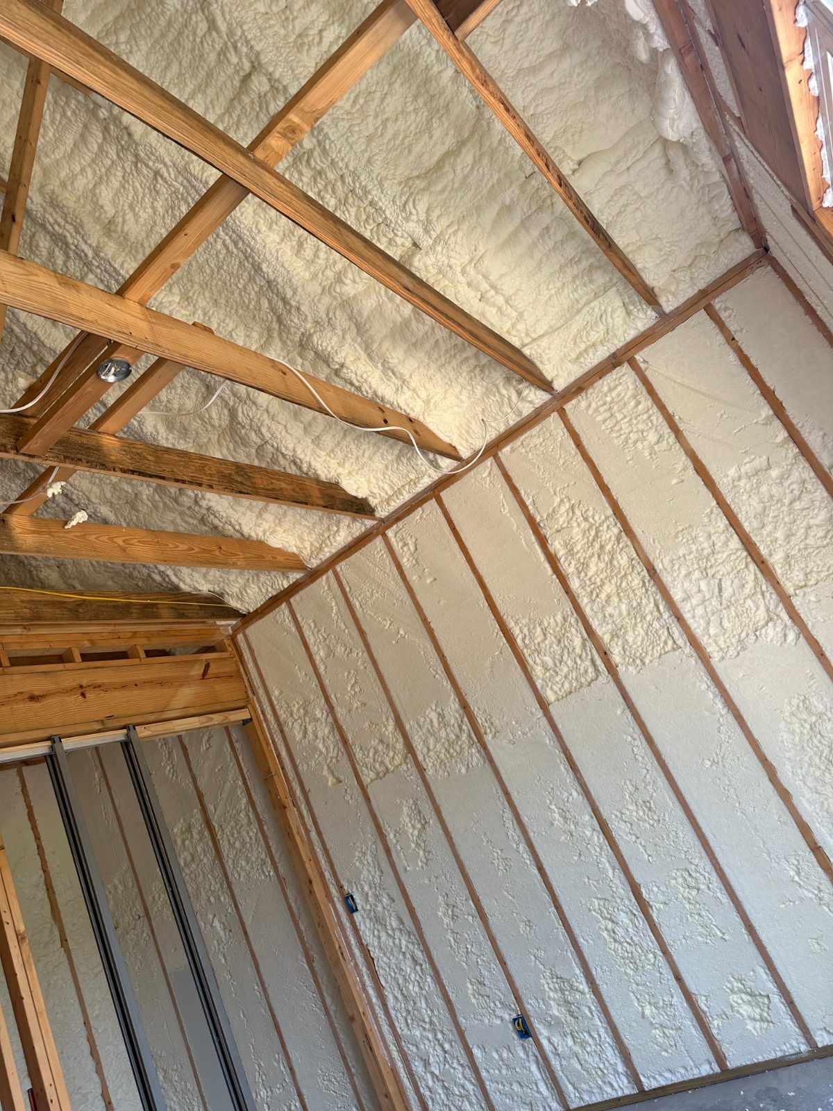 Open-cell spray foam between rafters with exposed framing — Mississippi